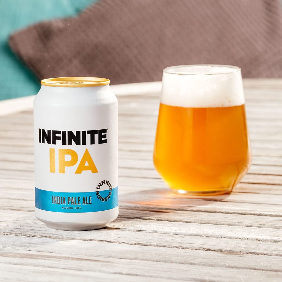 Infinite IPA alcohlol free can and glass filled with it