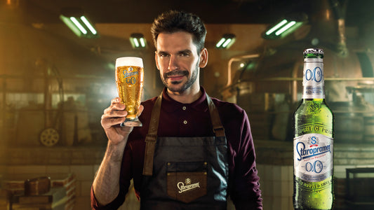 Man holding a Staropramen Non-Alcoholic beer